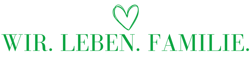 Ein grünes Herz und der Satz "Wir leben Familie"